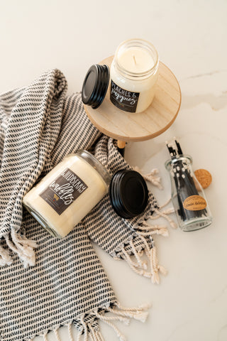 some farmhouse candles in a lifestyle picture with some matches