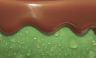 carmel dripping down a green apple