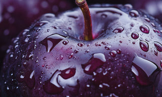 close up of a plum with water droplets
