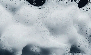 suds on a black background