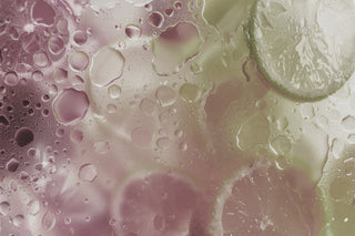 blurred image of lime slices and bubbles