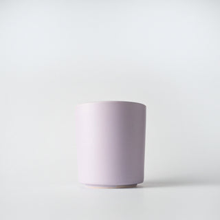 a lavender tumbler of blackberry and basil candle