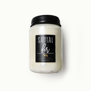 Scented candle jar labeled 'Santal Fir' on a white background
