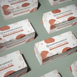 Milhouse Candle Co. DIY Candle Kit boxes on a green background