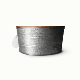 Large metal candle with wooden lid on a white background
