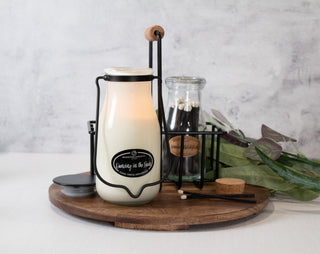 a lifestyle photo of a milkhouse bottle and matches on a tray 
