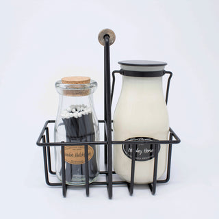 the milkbottle and matches in a black carrier 