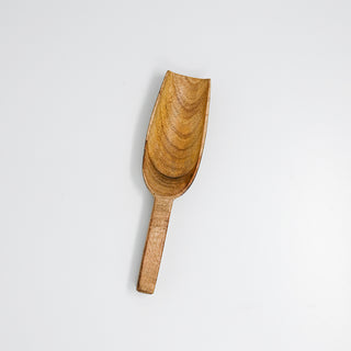 Wooden scoop on a white background