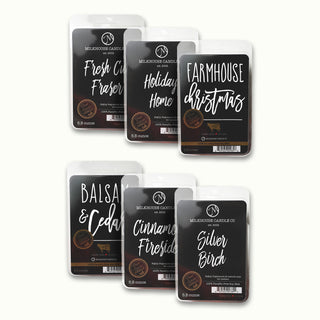 Set of six Milkbarn Candle Co. wax melts with labels on a white background