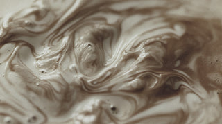 a close up of a frothy mix of cream and carmel 