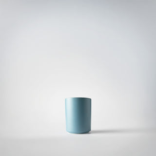 a cerulean votive of coastal cerdarwood with a white background 