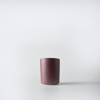 a burgandy votive of flecked iced winterberry candle 