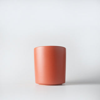 a yam colored tumber of golden pumpkin candle  