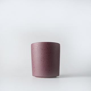 a burgundy flecked tumbler with iced winterberries candles