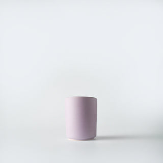 a lavender votive of blackberry and basil candle 