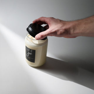 22oz mason jar with the metal lid being put on 