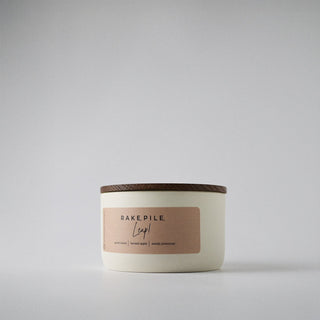 the cream ceramic statement collection jar with a wood lid and white background 