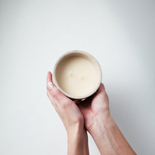 luna and lux candle held 