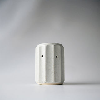 a white ribbed column melter 