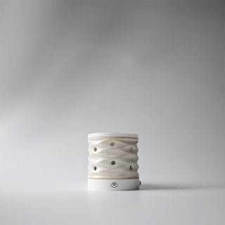 a white lattice wall plug in melter 