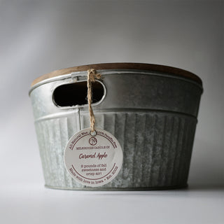 a close up of a monster candle with the letter pressed hang tag label shown